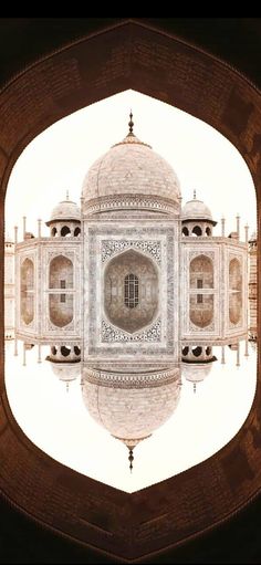 an image of the tajwa tower in india taken from inside its arch, looking up