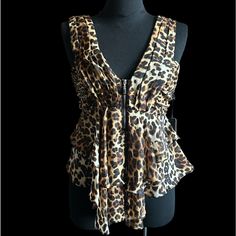 Leopard Print Sleeveless Top Plunging Neckline Ruched Waist Exposed Silver Front Zipper Tiered Ruffle Hem Fabric 100% Polyester Measures Small Ap 15 W 28 L 23 Med Ap 16 W 29 L 24 Large Ap 17 W 30 L 25 *Bundle For Discount *Ships Same Or Next Business Day Leopard Print Top Tops Blouses Streetwear Elegant Sleeveless Leopard Print Tops, Leopard Print Sleeveless Tank Top For Party, Chic Leopard Print Sleeveless Top, Elegant Leopard Print Blouse For Summer, Sleeveless Leopard Print Top For Night Out, Wrap Tunic, Lace Short Sleeve Top, Flare Long Sleeve, Printed Sleeveless Top