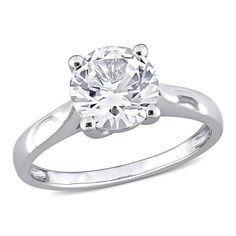 a white gold ring with a round cut diamond