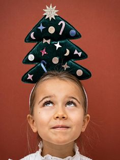 Look the part this Christmas with our tree-mendous headdress! Adorned with lots of jolly embellishments, perfect for creating a festive atmosphere!• Featuring sparkling stars, crescent moons, candy canes, baubles and bows to capture the Christmas spirit perfectly!• Ribbon wrapped alice band to fit ages 3-10 years• Warning! Not suitable for children under 36 months Sparkling Stars, Alice Band, Ribbon Wrap, Christmas Accessories, Candy Canes, Winter Decor, Merry And Bright, Headdress, Christmas Spirit