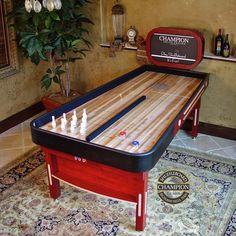 a game table with two pieces of chess on it in front of a chandelier