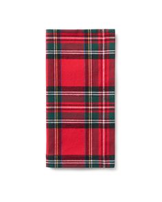 a red and green plaid napkin on a white background