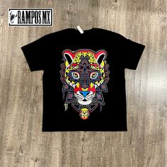 Handmade Serigraphy Print, Mexican Mens Jaguar T-Shirts Tiger Graphic Tees that are super stylish , bright and glow in Blacklight , Neon Lights, Mexican Art Skull Jaguar shirts , made by Artisans in Mexico in several designs . Mexican men Shirts. Short sleeve Men's apparel made of ultrasoft 100% cotton, this comfortable style is designed with a classic crew neckline, short sleeves and relaxed Fit, Our t-shirt is a perfect gift for that special person near you. Please check the Product images for Glow In The Dark Crew Neck T-shirt For Streetwear, Multicolor Streetwear Tops With Screen Print, Multicolor Graphic Tee With Front Print, Multicolor Screen Print Tops For Streetwear, Black Graphic Tee With Front Print Sublimation, Multicolor Band Merch T-shirt With Graphic Print, Multicolor Graphic Band Merch T-shirt, Multicolor Band Merch T-shirt With Graphic Design, Multicolor Band Merch Top With Graphic Design