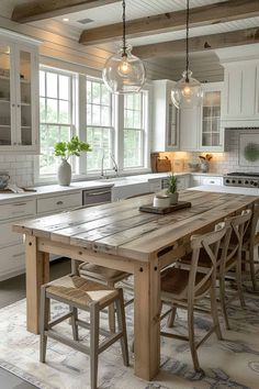 a large wooden table sitting in the middle of a kitchen