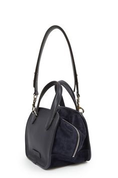 Designed and handcrafted in Italy, La Sophia bag combines leather and suede for a contemporary yet timeless piece. Complete with an adjustable, removable strap and internal pockets this bag gives you versatility and style. Details 8 1/2" H x 8 1/2" W x 7 1/2 D Handle drop: 4" Strap drop: 12"- 20" (adjustable) Handmade in Italy from leather and suede partially lined in canvas Silver hardware 2 internal pockets, 1 with zipper EXCHANGE ONLY La Sophia Bag - D/1017/CR Silver Hardware, Dark Navy, Timeless Pieces, In Italy, Italy, Zipper, Navy, Canvas, Leather