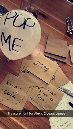 there is a balloon that has been placed on the table with some writing on it