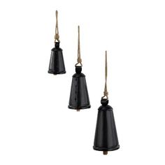 three black bells hanging from rope against a white background