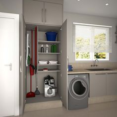 a laundry room with a washer and dryer next to a kitchen counter top