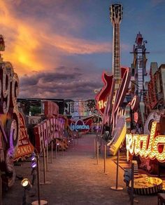 an assortment of neon signs and guitars are on display at the fairground in las vegas