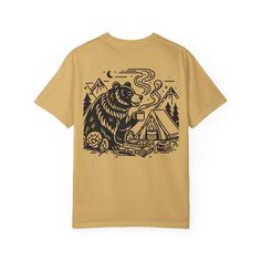 This comfort Colors tee made 100% with ring-spun cotton features a tent on the front and a bear drinking coffee on a camping trip on the back! The soft-washed, garment-dyed fabric brings extra coziness to your wardrobe while the relaxed fit makes it an excellent daily choice. The double-needle stitching throughout the tee makes it highly durable while the lack of side-seams helps the shirt retain its tubular shape.  The Comfort Colors tee is made with medium fabric (6.1 oz/yd; (206.8 g/m)) consisting of high quality, 100% ring-spun US cotton for long-lasting comfort. The relaxed fit keeps the wearer comfy in both casual and semi-formal settings while the crew neckline delivers that classic, neat style which makes it perfect for accessorizing.  The pre-shrunk fabric ensures a consistently g Graphic Tee T-shirt With Relaxed Fit For Camping, Graphic Tee With Relaxed Fit For Camping, Casual Crew Neck Camp Shirt With Graphic Print, Screen Print Graphic Tee For Camping, Relaxed Fit Screen Print T-shirt For Camping, Outdoor Short Sleeve T-shirt With Front Print, Cotton Camp Shirt With Graphic Print For Outdoor Activities, Outdoor Cotton T-shirt With Sublimation Print, Graphic Tee For Camping