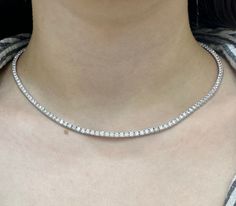 This necklace features 9.16ct round cut diamonds. F-G VS2 with prong setting. LAB grown diamonds, 16 inches, DNOII. Tennis diamond necklaces are considered a symbol of opulence and grace. They complement a wide range of outfits and are often chosen for special occasions, as well as being passed down as heirlooms within families. These necklaces are known for their enduring appeal and timeless beauty, making them a treasured addition to any jewelry collection. Diamond Tennis Necklace, Diamond Necklaces, Tennis Necklace, Wedding Jewellery Necklace, Wedding Necklace, Round Cut Diamond, Prong Setting, Timeless Beauty, Lab Grown