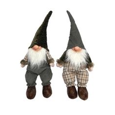 two garden gnomes are standing next to each other