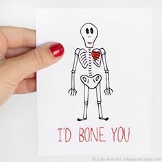 someone holding up a card that says i'd bone you with a skeleton on it