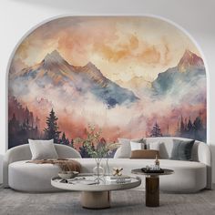 a living room filled with furniture and a painting on the wall above it's couches