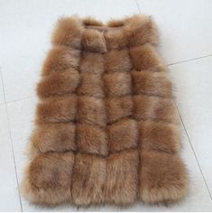 The faux fox fur waistcoat has an eye-popping hue that proffers an amazing look this winter. This sleeveless coat is sure to make heads turn, owing to its fabulous design. Crafted in great quality material, this O-necked coat is fashioned for plus sized women. Its covered button closure adds class to this casual coat, ensuring you get noticed. Available at a fair cost, it is surely worth purchasing. Order today! Specifications Gender: WomenOuterwear Type: Fur & Faux FurType: Sleeveless VestC Fur Bags, Fur Vest Women, Fur Waistcoat, Waistcoat Fashion, Long Fur Coat, Fox Fur Vest, Sleeveless Coat, Coat Women Fashion, Fur Clothing