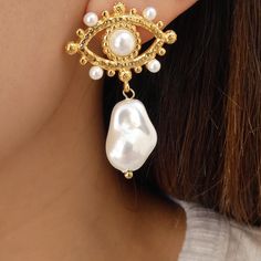 Lightweight Material: gold plated stainless steel Drop: 1.5" For pierced ears IMPORTED Trendy Gold Metal Plug Earrings, Single Teardrop Metal Pearl Earring, Gold Dangle Hoop Earrings, Gold Metal Pearl Earrings, White Metal Earrings Tarnish Resistant, Trendy Metal Jewelry With Pearl Drop, Trendy Gold Metal Pearl Earrings, Gold Stainless Steel Pierced Earrings, Metal Pearl Earrings With Plating For Gifts