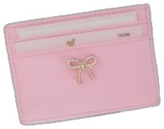 a pink card holder with a bow on it