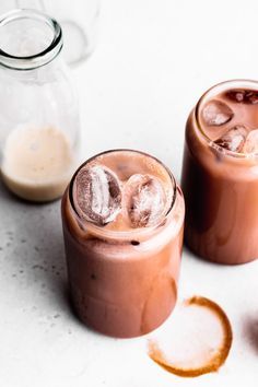 two glasses filled with ice cream and chocolate