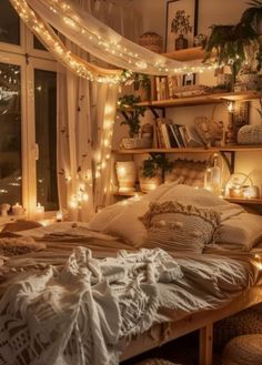 an unmade bed with lots of lights on the headboard and shelves above it