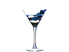 a martini glass with an olive garnish on the rim and blue liquid in it