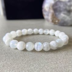 100% Authentic Crystal | USA | 3 Days Free Shipping | ASANA High-Grade Moonstone Bracelet for New Beginnings and Intuition by Asana Crystals ♥ Inner Clarity ♥ Feminine ♥ Intuition ♥ Balance ♥ New Beginnings ♥ Wisdom Embrace the enchanting allure of moonstone with the Moonstone Beaded Bracelet from Asana Crystals. Each bead has been polished to perfection, showcasing the gemstone's ethereal iridescence that is both mesmerizing and mystical. This bracelet is not just a piece of jewelry, but a symb Feminine Intuition, Moonstone Crystal, Moonstone Bracelet, Moonstone Beads, Emotional Balance, Bead Charm Bracelet, Wire Bracelet, Unique Gemstones, Nature Bracelets