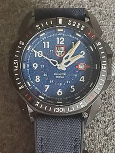 Hi Buyers You are buying a Luminox ICE-STAR ARTIC Blue Dial/Blue Strap Men's Watch XL.1003.ICE. Pre-owned but in the box with manual and in mint conditions, see all pictures for more details. Its has 2 tone luminox hands orange and hour marks yellow, date indicator, water resistant 200m. Very cool every day ware watch or to dive with. Follow me as I will be posting more treasures for you to buy every week, thanks Durable Blue Watch With Round Dial, Luminox Watches, Ice Star, Dive Watches, Wristwatch Men, Wrist Watches, Men's Watch, Breitling Watch, Jaeger Watch