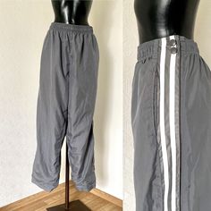 Pants Retro Running Basketball 80s Warm Up Sportswear Breakaway Snap Up The Leg Athletic Workout HipHop Joggers Gray White Stripes Trousers ♥ High Waisted ♥ Gray Lining ♥ Elastic waist ♥ 2 Pockets on sides ♥ Snap button closure up the Leg Condition: Being vintage the item has been pre-owned but remains in excelent vintage condition. Tag: Athletic Works Materials: 100% polyester Size: No Tags ( Fits on XXL) Measurements: laying flat and tied closed Length: 112cm = 44,1'' Waist: max 120cm = 47,2'' Hips: 136cm = 53,5'' Trousers Leg Length inside: 80cm = 31,5'' Front Rise: 38cm = 15'' Leg Width Bottom: 43cm = 17'' Pant Leg Opening : 26cm = 10,2'' **Measurements are taken with the garment lying flat. (Some sizes then doubled - Bust, Waist, Hips). Be sure to leave room for movement and comfort** Retro Stretch Sports Bottoms, Retro Stretch Bottoms For Sports, 90s Style Sports Pants With Pockets, Gray Hip Hop Long Pants, Vintage Track Pants, Vintage Track Pants White, Hip Hop Full-length Sweatpants With Pockets, Athlete Workout, High Waisted Trousers