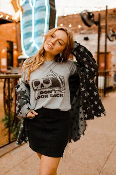 We think spooky graphic tees should be a thing all year round. If you agree, then we think you’ll love our Don’t Look Back Graphic Tee. A grey shirt with black graphic of a skeleton looking back in the rearview mirror. Pair it with some flare jeans for a spooky inspired casual look! Gray Grunge T-shirt For Fall, Spooky Graphic Tees, Don't Look Back, A Skeleton, Dont Look Back, Distressed Denim Jacket, Johnny Cash, Saved Items, Plus Size Shopping