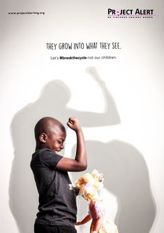 a young boy holding a teddy bear in front of a white wall with the words, they grow into what they see