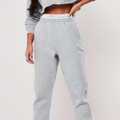 Missguided Gray Joggers, Tape Waistband And Side Pockets ~Size 8 ~Color Grey ~Gray Joggers ~Featuring A Missguided Tape Waistband And Side Pockets. ~Regular Fit Ankle Grazer - Sits On The Ankle Bone ~52% Polyester 48% Cotton ~Machine Wash Casual Pants With Logo Waistband, Sporty Solid Bottoms With Logo Waistband, Spring Bottoms With Logo Waistband, Stretch Bottoms With Logo Waistband For Loungewear, Playboy Sweatpants, Brown Sweatpants, Leather Jogger Pants, Gray Joggers, Fall Streetwear