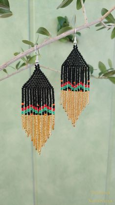 These handmade earrings are made of high-quality Czech beads and strong synthetic thread.In these unique earrings I use my author's scheme . They are elegant, fashionable, and highly versatile, suitable for everyday wear. Color: black,red, green, orange . 100% hand made with love! Copy without my permission is prohibited Measurements: Length-about 10.5cm,Width -3 cm Materials: Silver tone metalic plated ear hooks Czech glass beads Tytan Thread Bohemian Orange Beaded Earrings With Black Beads, Traditional Black Beaded Earrings With Fringe, Brown Beaded Fringe Earrings For Festival, Southwestern Black Beaded Earrings For Festivals, Traditional Black Beaded Fringe Earrings, Native Earrings, Beaded Jewelry Earrings, Stitch Jewelry, Earrings Chandelier