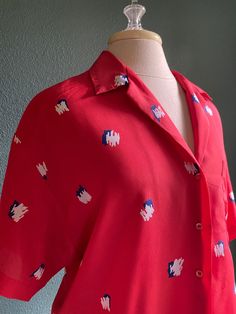 This vintage 1960s shirt looks like it came right of the racks of Anthropologie today Bright Red Background with retro navy and white print. Loose and flow with button front. Would look great paired with navy linen pants or jeans. Size 10 fits like medium  Made by Villager  Button Closure Red Linen Shirt, Navy Linen Pants, Party Blouse, Cheetah Print Dress, Bow Shirts, Navy Linen, Sheer Shirt, 1970s Fashion, Camp Shirt