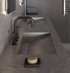 a bathroom with two sinks and mirrors on the wall