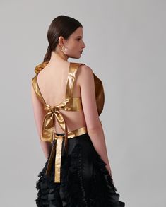 The SAXO is an opulent shirtfront delicately hand crafted from a smooth and luxurious metallic fabric to create an oversized statement flower. Starting along the shoulder the fabric blooms throughout the body, dwindling at the waistline, creating an impressive design, synonymous with the brand. The SAXO is enhanced with an open back and two tie straps for closure. #html-body [data-pb-style="62FB5CA891425"]{justify-content: flex-start; display: flex; flex-direction: column; background-position: l Top Background, Cover Background, Metallic Fabric, Fall Coat, Shoes Heels Boots, White Shirt, Designer Shoes, Open Back, Backless Dress