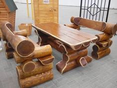 a wooden table and chairs made out of logs are on display at a furniture store