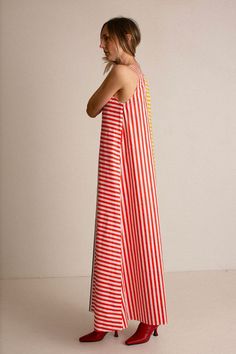 A line, maxi length dress with a simple scoop neck in a bold, colorblock stripe print. Gathers at the waist with a matching tie belt. Fabric is 100% cotton. Ella is 6' tall, 35" bust, 26" waist, 36" hip, and is wearing a size 2. Palm Royale, Vestidos Maxi, Bright Fabrics, Feminine Women, Fine Fabric, Tie Belt, Stripe Print, Sale Design, Smocking