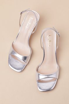 Whether you're the best-dressed guest or the bride-to-be, the Lulus Soline Silver Metallic Slingback Low Heel Sandals are perfect for any special occasion! Shiny, smooth faux leather shapes these luxe heels that feature a trendy square footbed, a tapered toe strap, and a slender, adjustable slingback strap that secures with a silver buckle. A unique, sculpted heel completes the simple and sensational design. 2. 75" sculpted heel. Cushioned insole. Rubber sole has nonskid markings. Man made mater Silver Low Heel Slingback Sandals For Summer, Heels Silver, Bride Shoes Low Heel, Silver Sandals Heels, Silver 4-inch Kitten Heels For Party, Silver Kitten Heels, Modern Silver Sandals With 4-inch Heel, Metallic Sandals With 4-inch Heel For Evening, Silver Kitten Heels With 4-inch Heel