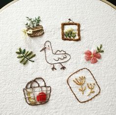 some embroidered items are sitting on a table