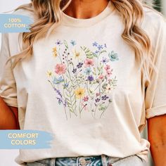 You will love the enchanting beauty of nature with this Vintage Pressed Flowers ComfortColors T-shirt. Designed for those who find joy in giftgifted pleasures of life, this tee captures the whimsical essence of a wildflower meadow. Each shirt is a canvas, adorned with a delicate arrangement of botanical florals, pressed and printed to perfection, evoking a sense of fairy magic. Ideal for giftful lovers of the natural world, this piece merges floral minimalist design with the cozy comfort of soft Cotton Fairycore T-shirt For Summer, Summer Fairycore Cotton T-shirt, Spring Fairycore Graphic Print T-shirt, Fairycore Short Sleeve Tops For Spring, Spring Fairycore Cotton Tops, Spring Fairycore Crew Neck T-shirt, Multicolor T-shirt For Spring Gift, Spring Tops As Gifts, Spring Gift Shirt With Relaxed Fit