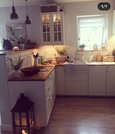 the kitchen is clean and ready to be used for cooking or baking, with candles on the counter