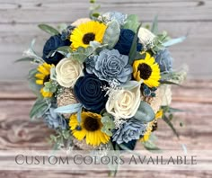 a bridal bouquet with sunflowers, roses and eucalyptus leaves on a wooden background