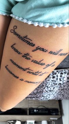 a woman with a tattoo on her leg saying something you want to know the world