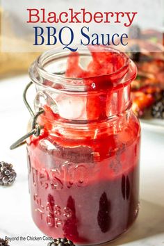 blackberry bbq sauce in a mason jar with berries on the side and text overlay that reads, blackberry bbq sauce