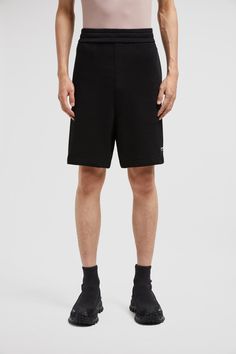 Mirroring the '90s aesthetic that permeates the collection, this pair of shorts have a streamlined appearance. The bottoms boast a comfortable design in cotton with an adjustable waistband. Black Cotton Shorts With Short Inseam, Casual Black Bermuda Shorts With Relaxed Fit, Sporty Relaxed Fit Bermuda Shorts For Streetwear, Sporty Cotton Bermuda Shorts For Streetwear, Black Cotton Bermuda Shorts With Short Inseam, Modern Black High-waisted Shorts, Sporty Black Cotton Bermuda Shorts, Black Bermuda Shorts With Relaxed Fit, Black Relaxed Fit Bermuda Shorts