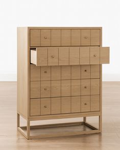 a wooden dresser sitting on top of a hard wood floor