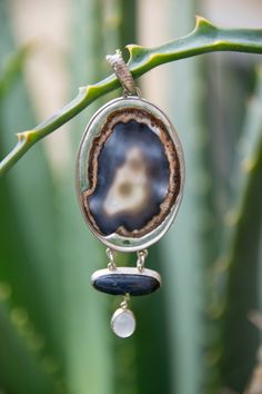 silver pendant with agate and two other smaller stones, tiger's eye and moonstone, which dangle held by small rings. Small Rings, Tiger's Eye, Tiger Eye, Pendant Necklaces, Silver Pendant, Moonstone, Jewelry Necklace Pendant, Agate, Design Ideas