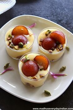 three desserts are arranged on a white plate