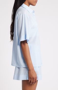 Crisp PJs with a collared short-sleeve shirt and elastic-waist shorts are ones you'll want to wear all weekend long. 26 1/2" length top; 2 1/2" inseam; 31" leg opening; 12 1/2" front rise; 16" back rise (size Medium) Top has front button closure; notched collar; short sleeves; chest patch pocket Shorts have elastic waist 55% cotton, 45% viscose Machine wash, tumble dry Imported Relaxed Blue Tops For Daywear, Blue Collared Shirt For Loungewear, Blue Short Sleeve Sleepwear For Summer, Solid Color Short Sleeve Sleepwear For Summer, Relaxed Fit Summer Sleepwear With Short Sleeves, Blue Collared Relaxed Fit Sleepwear, Summer Daywear Collared Camp Shirt, Summer Short Sleeve Camp Shirt For Daywear, Summer Collared Camp Shirt For Daywear