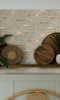 some baskets are sitting on top of a shelf