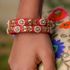 1 Organza Bag + Set of 2 Red Raw silk Bangles The hunt for a perfect gift pack ends here. Desi Favors gift pack with one organza potli bag, set of 2 bangles is an ideal gift for women. Be it karwachauth, religious events, puja, Golu , housewarming or Mehendi ceremony make your guests super happy by gifting these! Potli Bag : Brown Organza fabric potlis /pouches measures 5 inches x 4 inches Bangles Size : 2-6 and 2-4 (random sizes will be sent) Bangles Material: Raw Silk Fabric with Embossed zari Traditional Bangle As Festival Gift, Traditional Embroidered Potli Bag For Ceremonies, Festive Traditional Potli Bag, Traditional Embroidered Bangle For Festive Occasions, Traditional Multicolor Embroidered Potli Bag For Festivals, Rakhi Gifts For Sister, Organza Material, Brown With Red, Silk Bangles